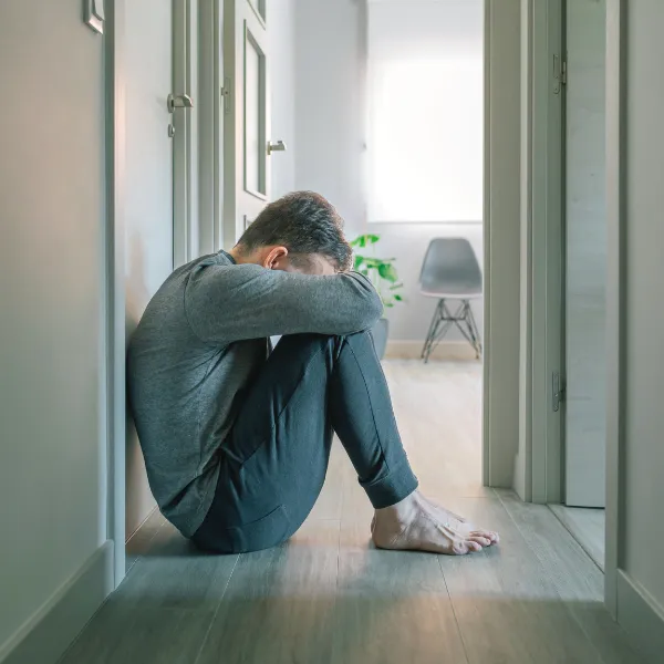 An image of a person experiencing emotional distress after a truck accident.