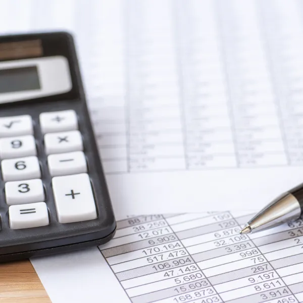 Image showing a calculator and financial documents related to lost wages.