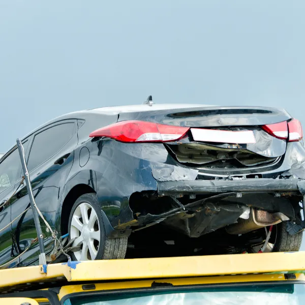 Image showing a damaged vehicle after a collision with an 18-wheeler.