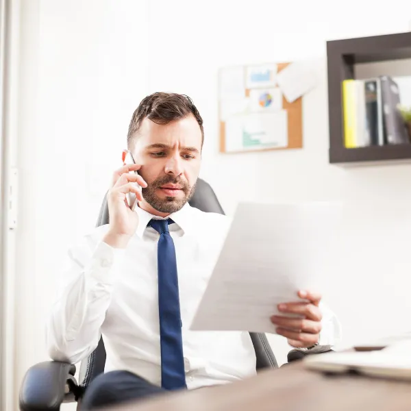 Image showing a lawyer on the phone negotiating with an insurance company.