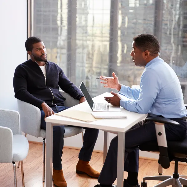Image showing a truck accident victim meeting with a lawyer.