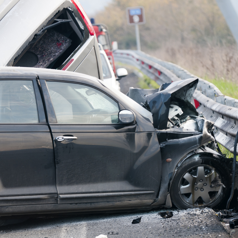 An image showing a commercial truck accident with a car. 