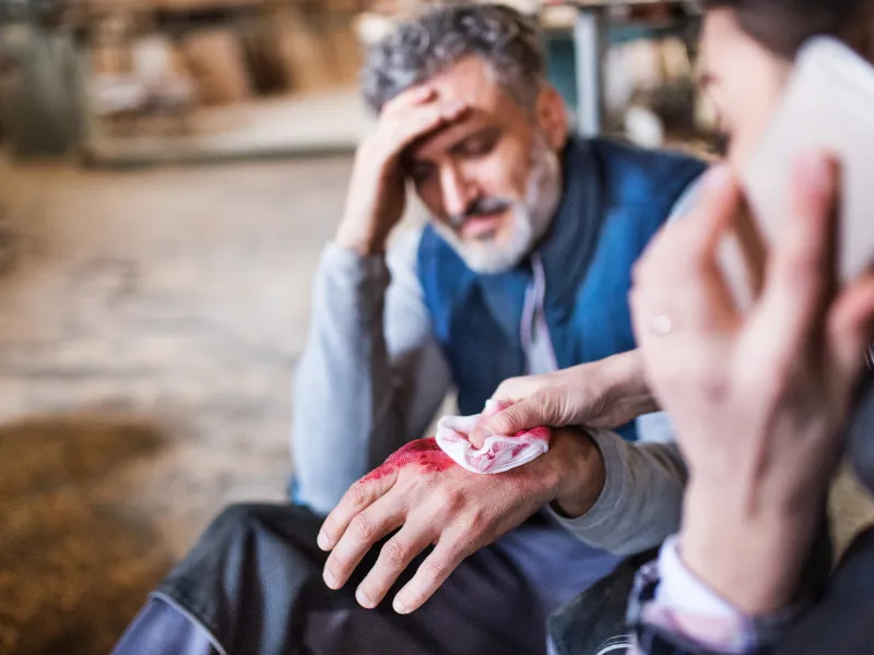 An image showing a person on the phone after an accident. 