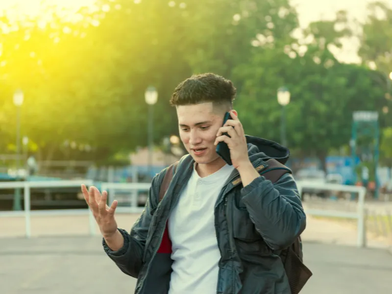An image showing a person on the phone calling their lawyer after a semi truck accident in Georgia. 