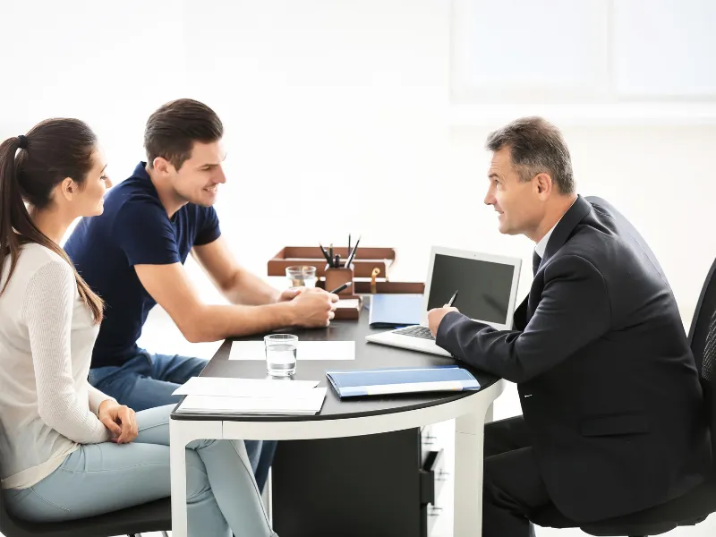 An image showing a person talking to a lawyer.